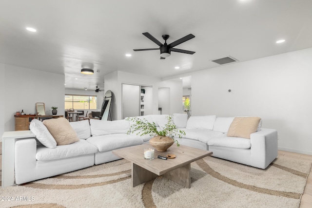 living room featuring ceiling fan