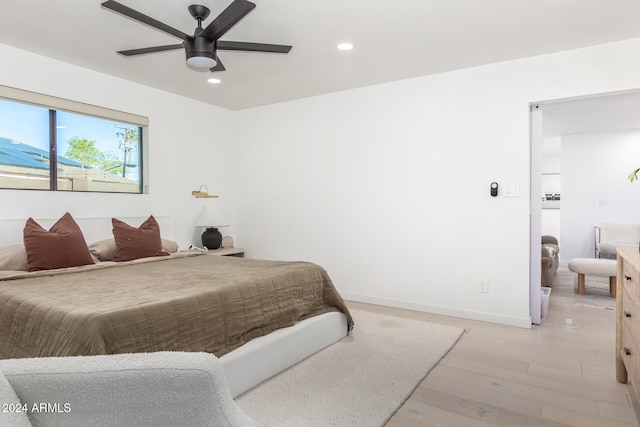 bedroom featuring light wood-type flooring and ceiling fan