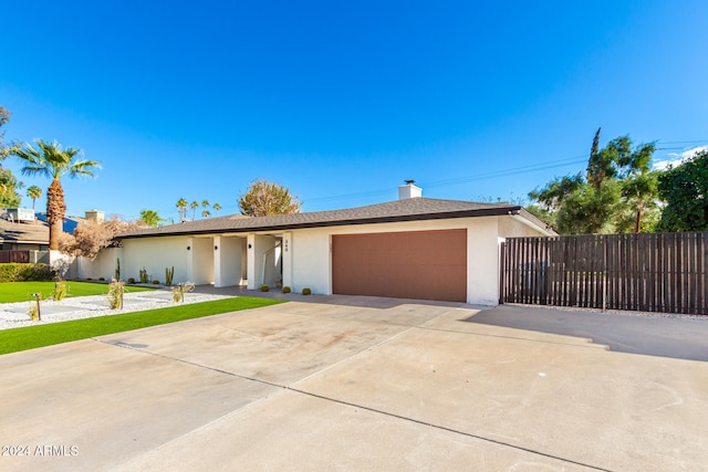 single story home with a garage