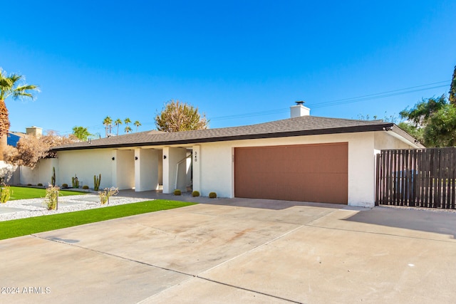 single story home with a garage