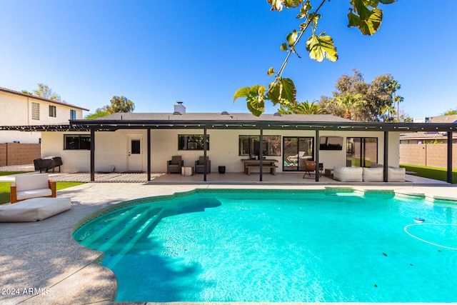 view of swimming pool featuring a patio area