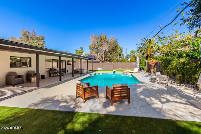 view of swimming pool with a patio