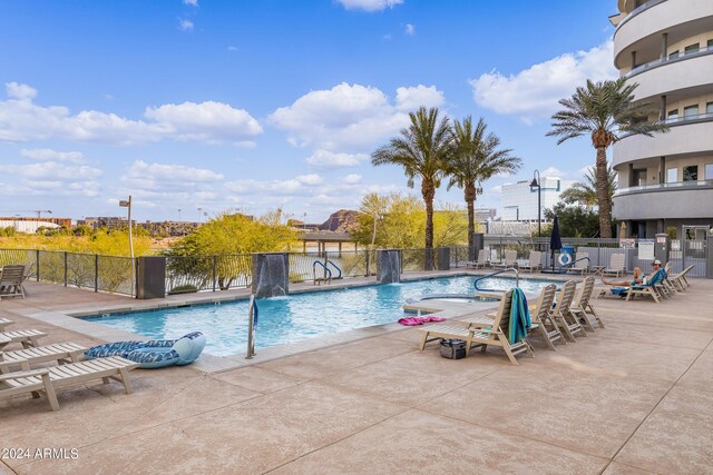 view of pool featuring a patio area and pool water feature