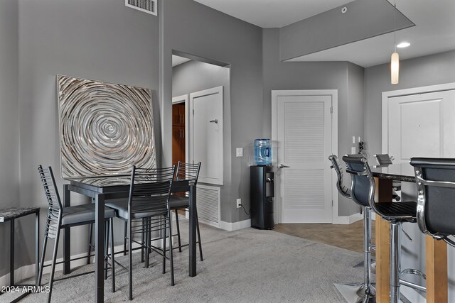 dining space featuring carpet flooring