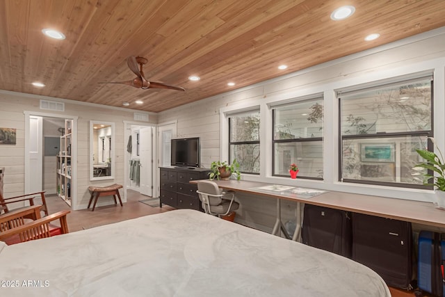 bedroom with wood-type flooring, wooden walls, and wood ceiling