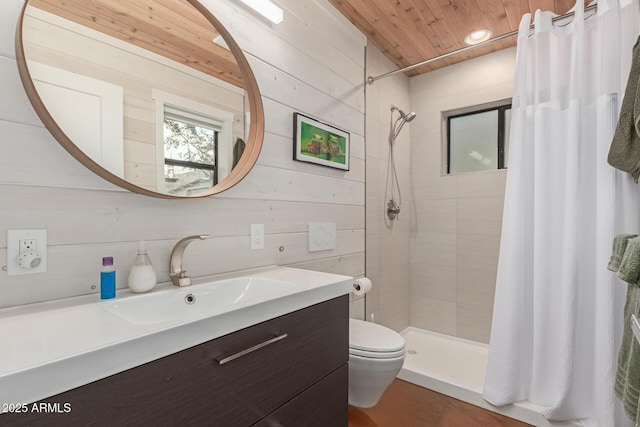 bathroom featuring wood walls, vanity, toilet, wooden ceiling, and a shower with curtain