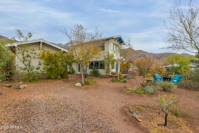 back of house featuring a mountain view