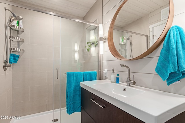 bathroom with vanity and an enclosed shower