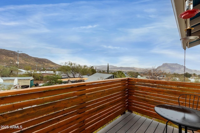 wooden deck featuring a mountain view