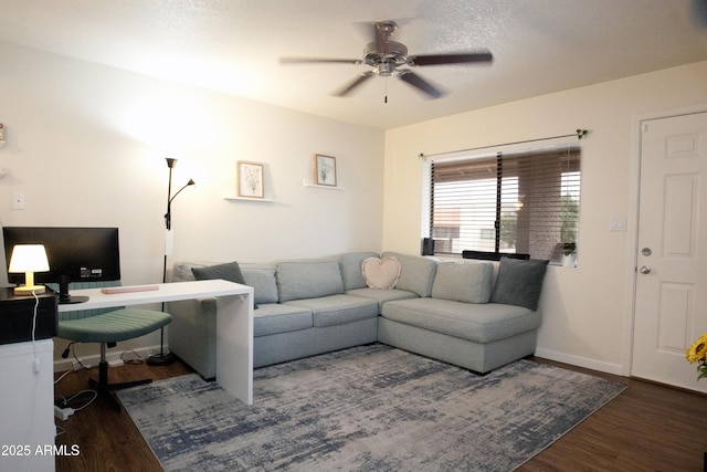 living room featuring wood finished floors and ceiling fan