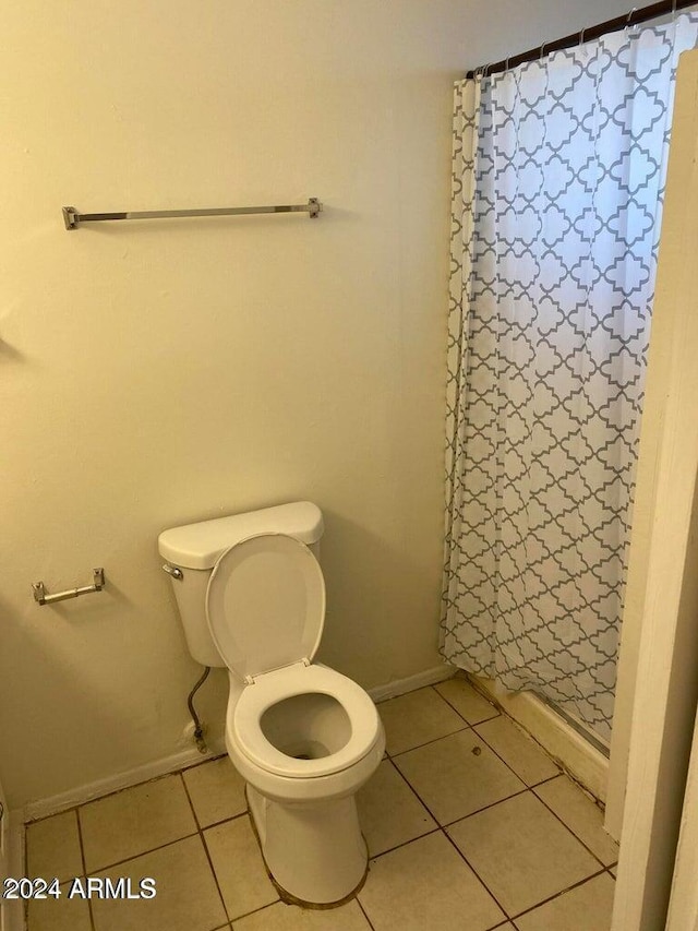 bathroom with tile patterned floors and toilet