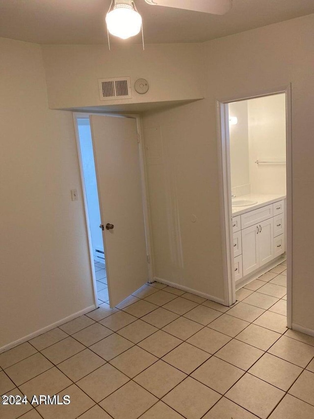 tiled empty room with sink