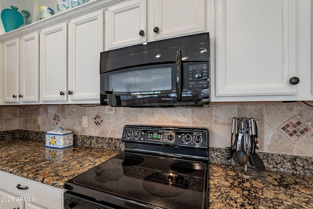 kitchen with backsplash, white cabinets, dark stone counters, and black appliances