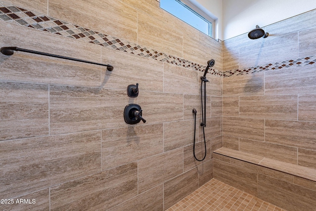 bathroom featuring tiled shower