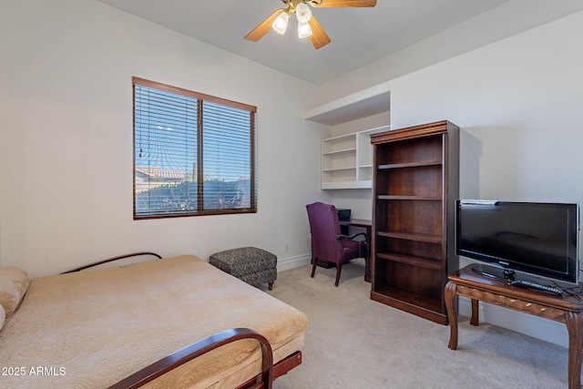 bedroom featuring light colored carpet and ceiling fan