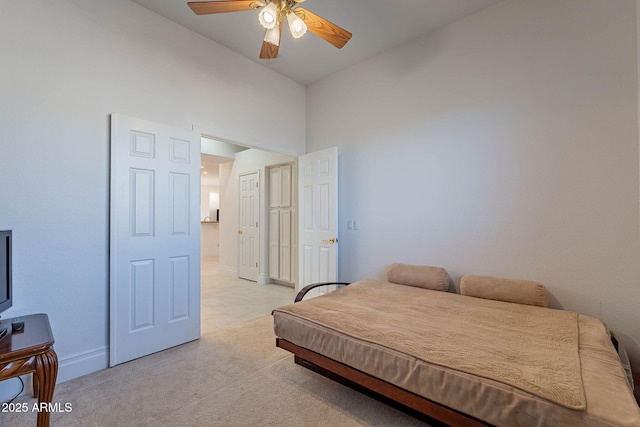 bedroom with light colored carpet and ceiling fan