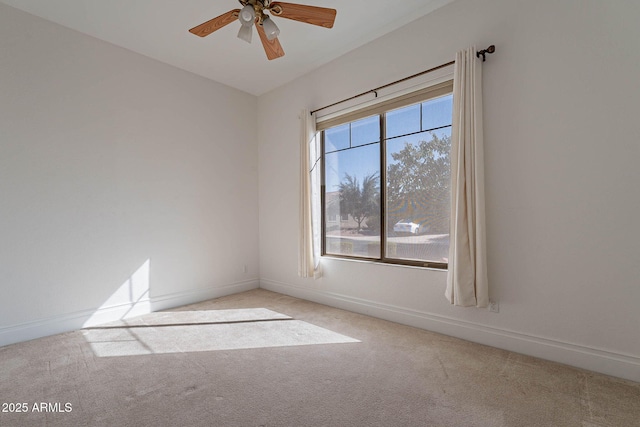 empty room with light carpet and ceiling fan