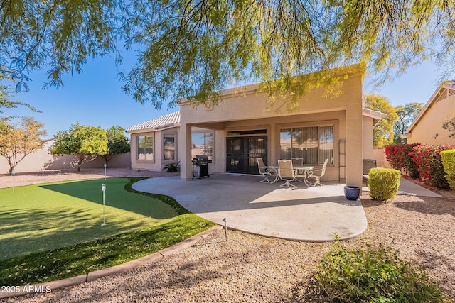 rear view of property with a patio