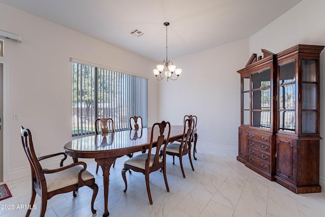 dining area with a notable chandelier