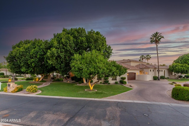 view of front of home featuring a lawn