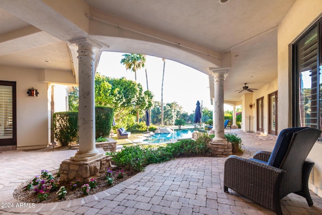 view of patio featuring ceiling fan