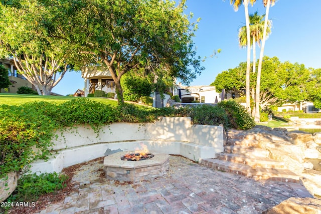 view of patio featuring a fire pit