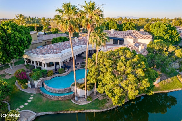 birds eye view of property with a water view