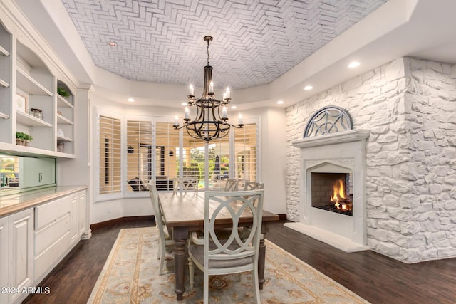 dining space with brick ceiling, dark hardwood / wood-style flooring, and a notable chandelier