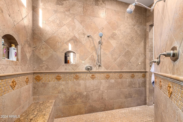 bathroom featuring tiled shower