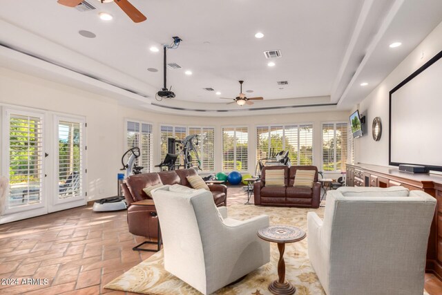 interior space with a raised ceiling and plenty of natural light