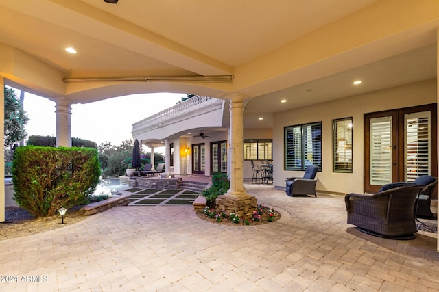 view of patio / terrace featuring ceiling fan