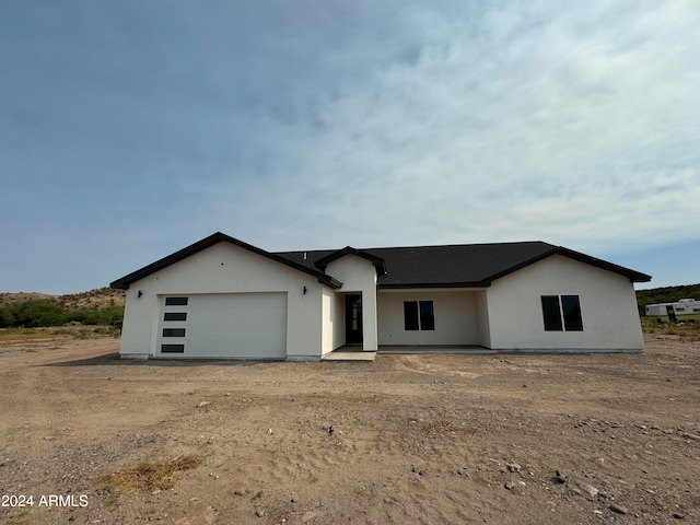 single story home with a garage