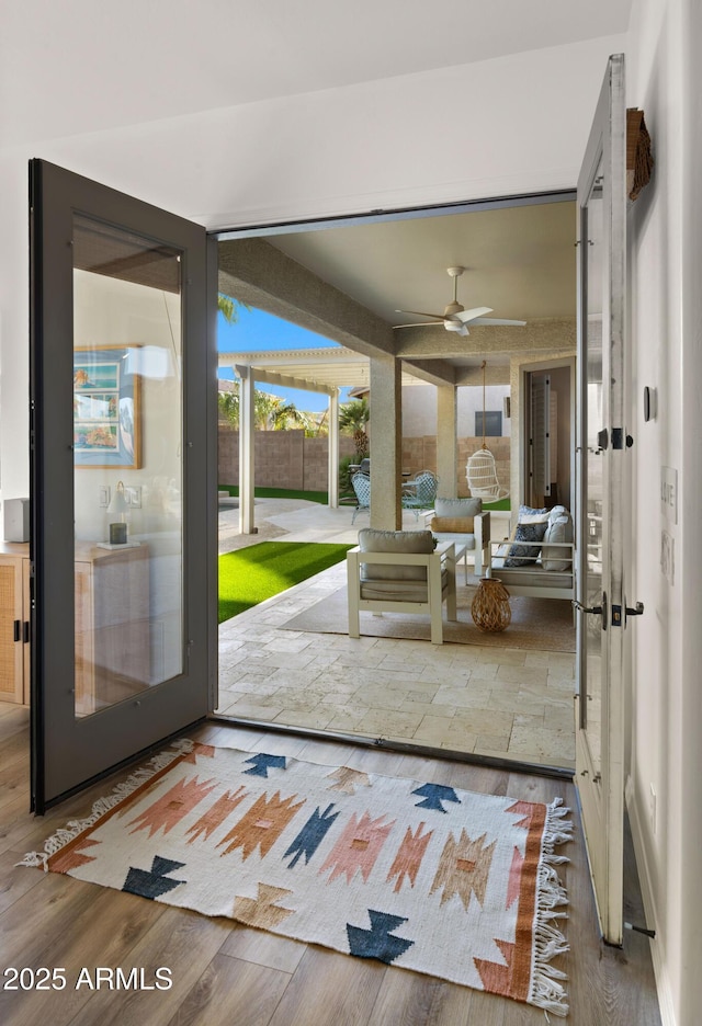 doorway to outside with french doors and wood finished floors