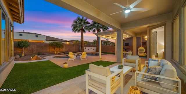 view of patio / terrace featuring an outdoor hangout area, a ceiling fan, and a fenced backyard