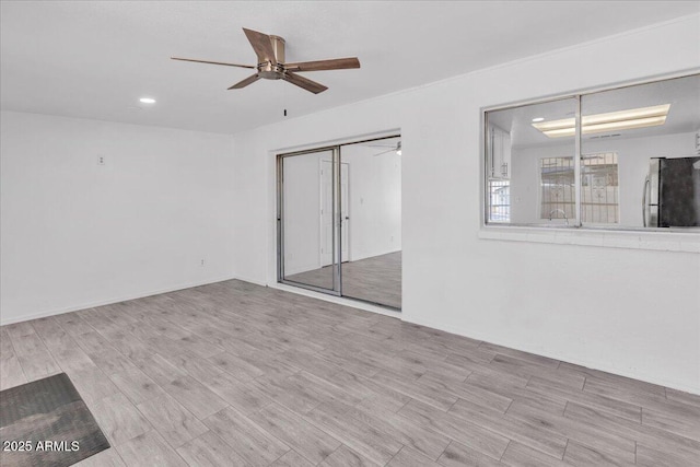 interior space featuring ceiling fan, recessed lighting, and wood finished floors