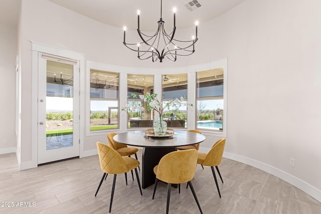 3940 Rolling Stock Way, Wickenburg, AZ 85390 - dining area with a wealth of natural light, visible vents, baseboards, and a chandelier
