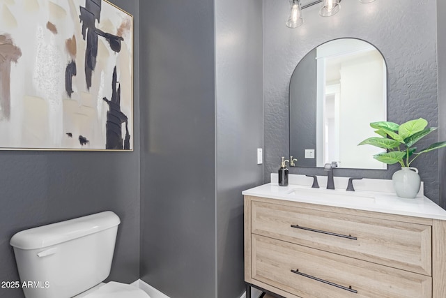 3940 Rolling Stock Way, Wickenburg, AZ 85390 - half bathroom featuring toilet, vanity, and a textured wall