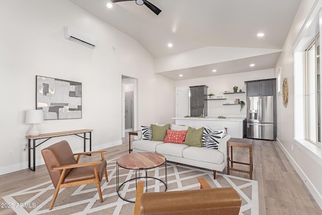 3940 Rolling Stock Way, Wickenburg, AZ 85390 - living room with light wood-type flooring, an AC wall unit, vaulted ceiling, and ceiling fan