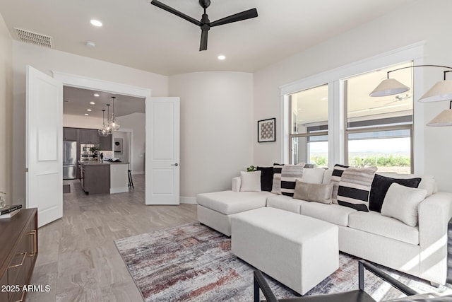 3940 Rolling Stock Way, Wickenburg, AZ 85390 - living room with light wood-style flooring, a ceiling fan, visible vents, and recessed lighting