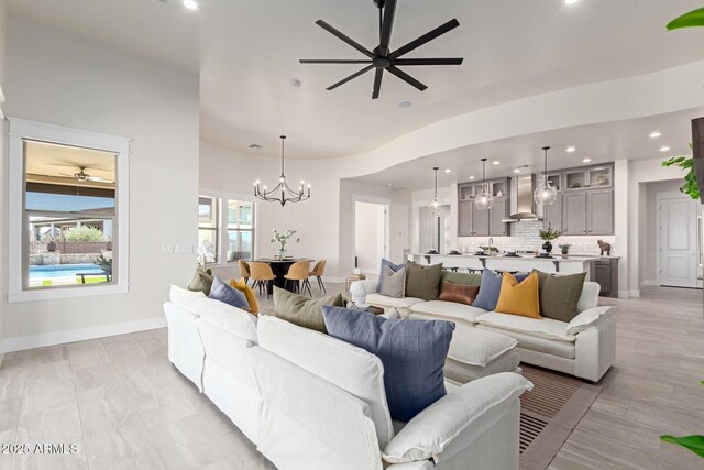 3940 Rolling Stock Way, Wickenburg, AZ 85390 - living area featuring baseboards, recessed lighting, and ceiling fan with notable chandelier