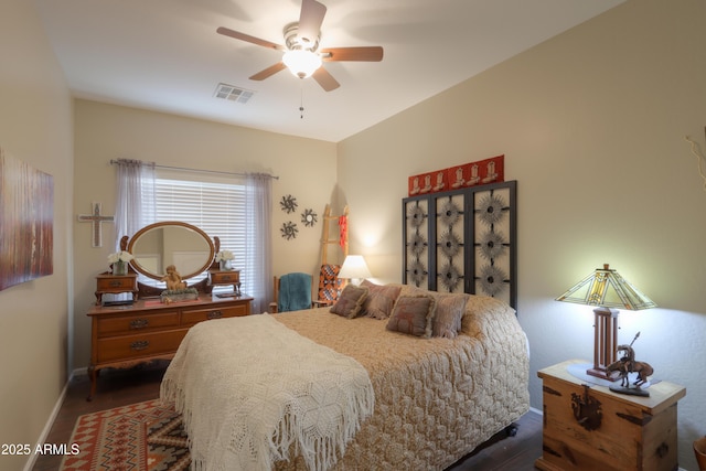 bedroom featuring hardwood / wood-style floors and ceiling fan