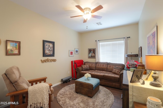 living room with dark hardwood / wood-style floors and ceiling fan