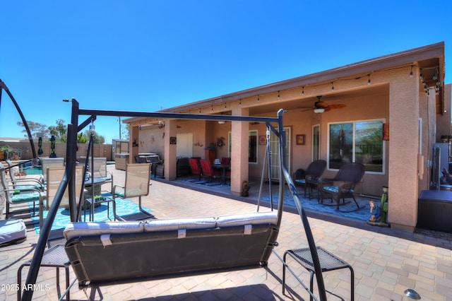 view of patio featuring ceiling fan