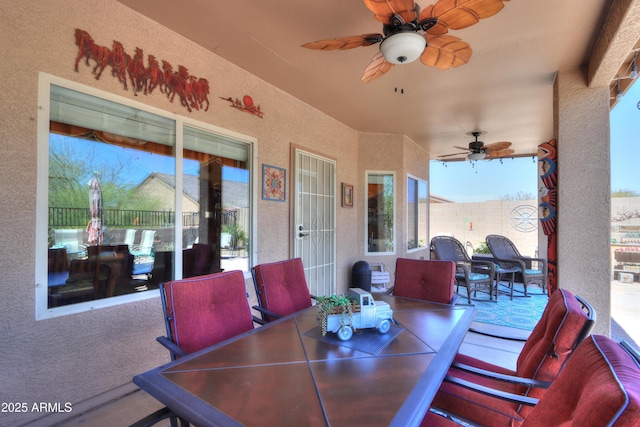 exterior space with ceiling fan