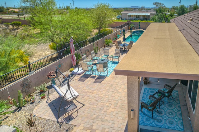 view of swimming pool with a patio area