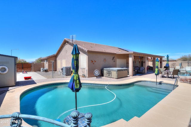 view of swimming pool with central AC, a hot tub, and a patio area