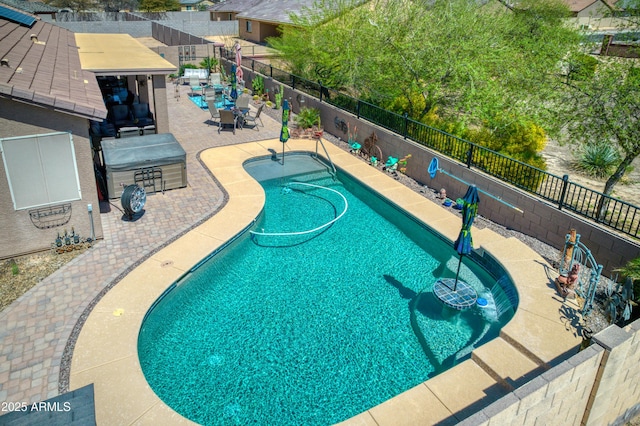 view of swimming pool featuring a patio