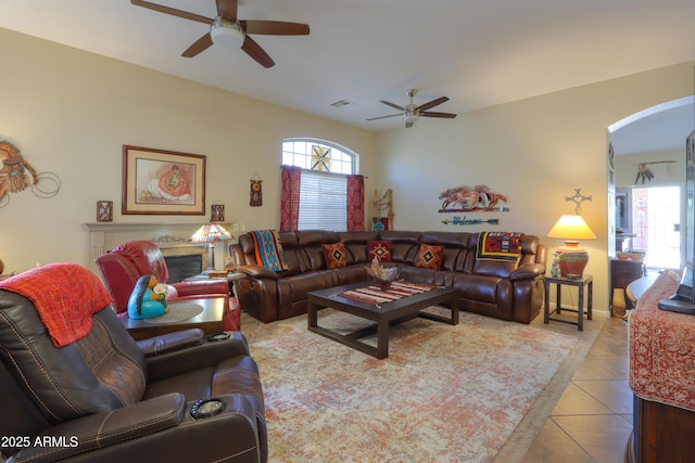 living room featuring ceiling fan and light tile patterned floors