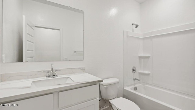 bathroom featuring toilet, shower / washtub combination, and vanity