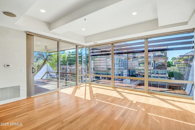 interior space with recessed lighting, visible vents, and wood finished floors